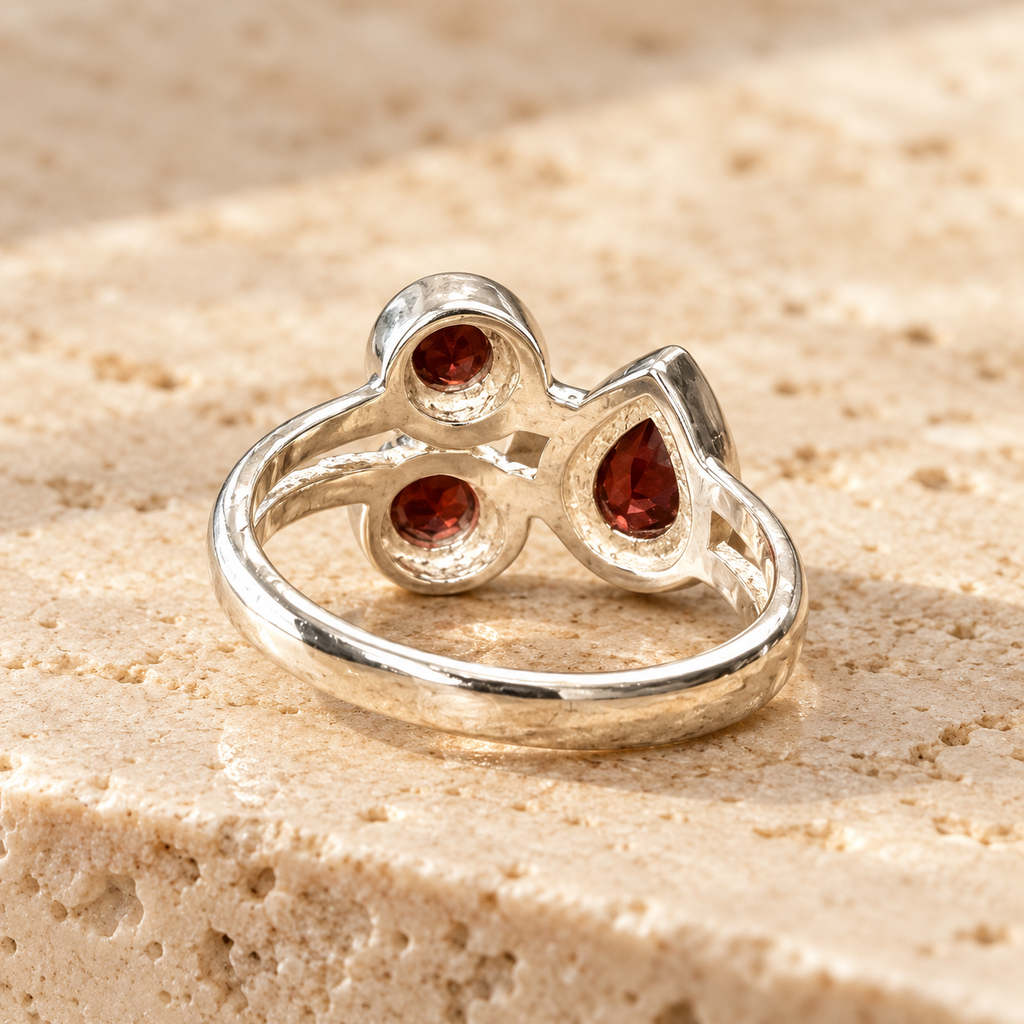 Three-stone garnet sterling silver ring, rear open setting