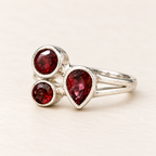 Three-stone garnet sterling silver ring, three-quarter view