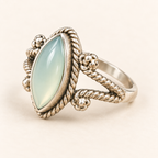 Three-quarter side view of aqua chalcedony ring