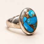Three-quarter view of blue copper turquoise ring