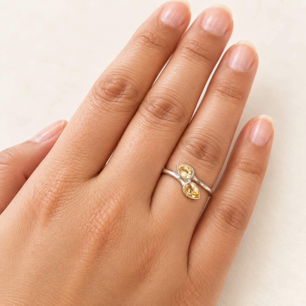 Citrine bypass ring worn on hand