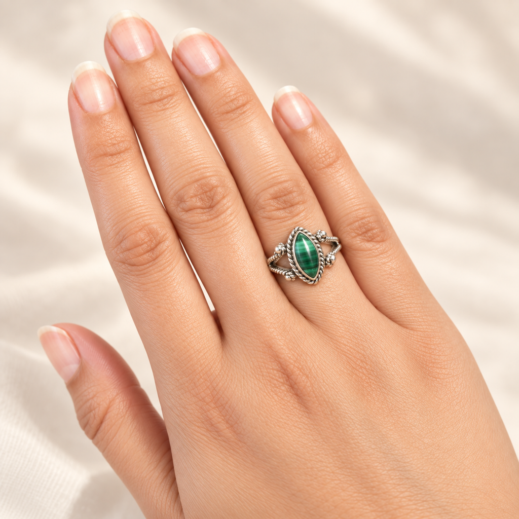 Malachite marquise ring worn on hand