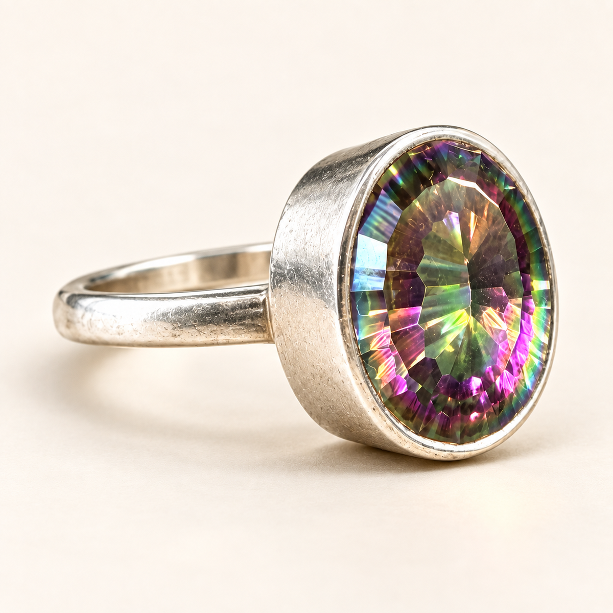 Three-quarter view of mystic quartz ring
