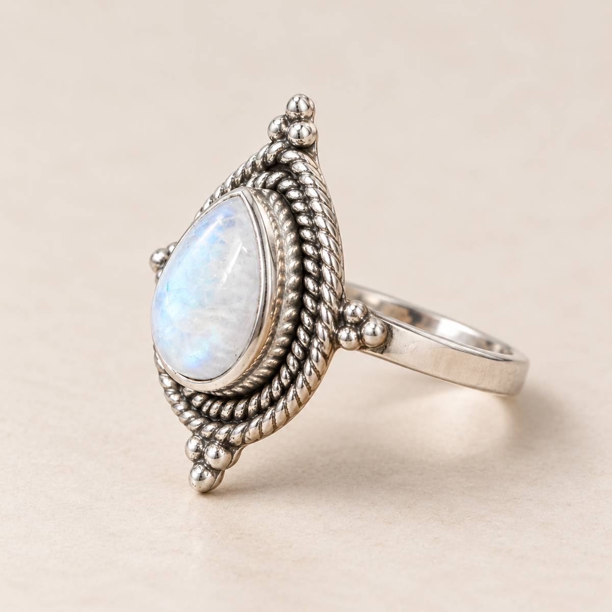 Three-quarter profile of rainbow moonstone ring