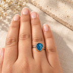 Raw apatite ring worn on hand